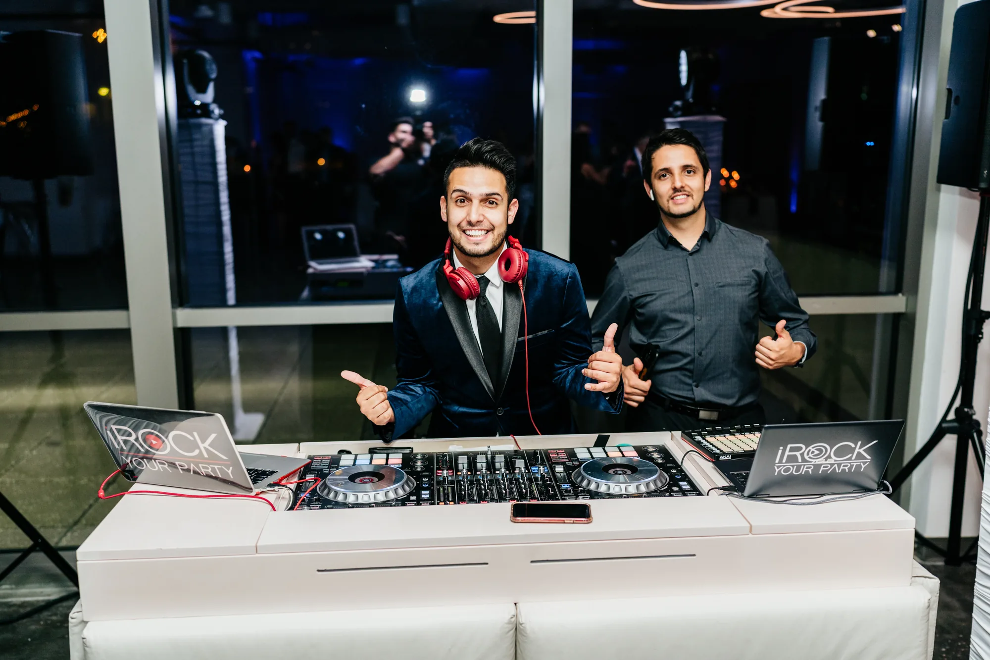 Two iRock Your Party DJs behind the booth at an Orlando event