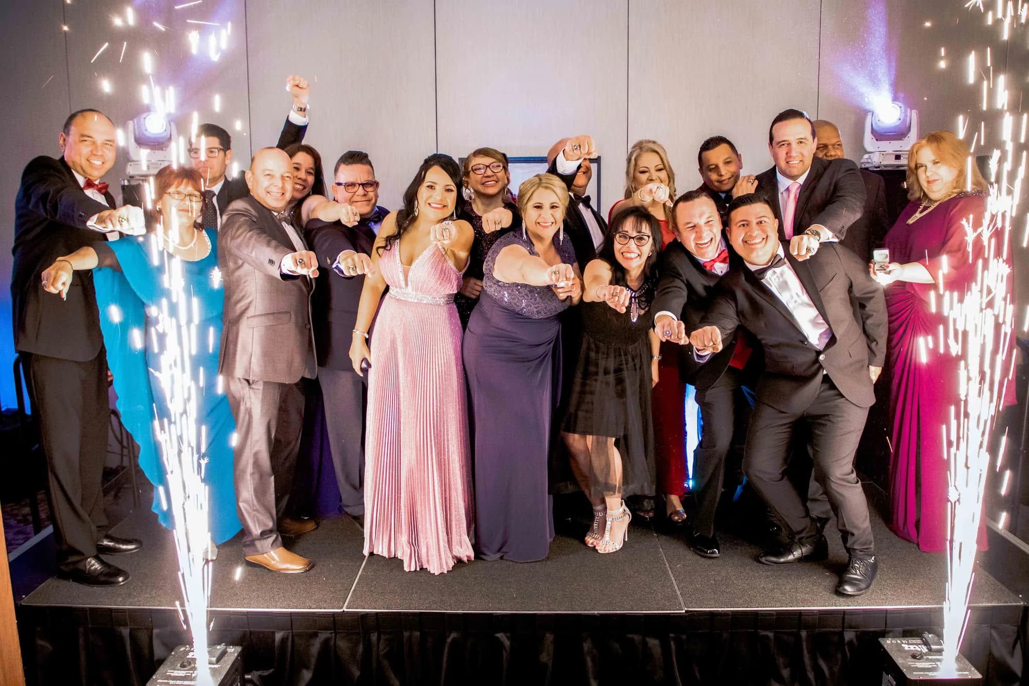 Cold spark fountains framing guests on stage at an Orlando corporate gala