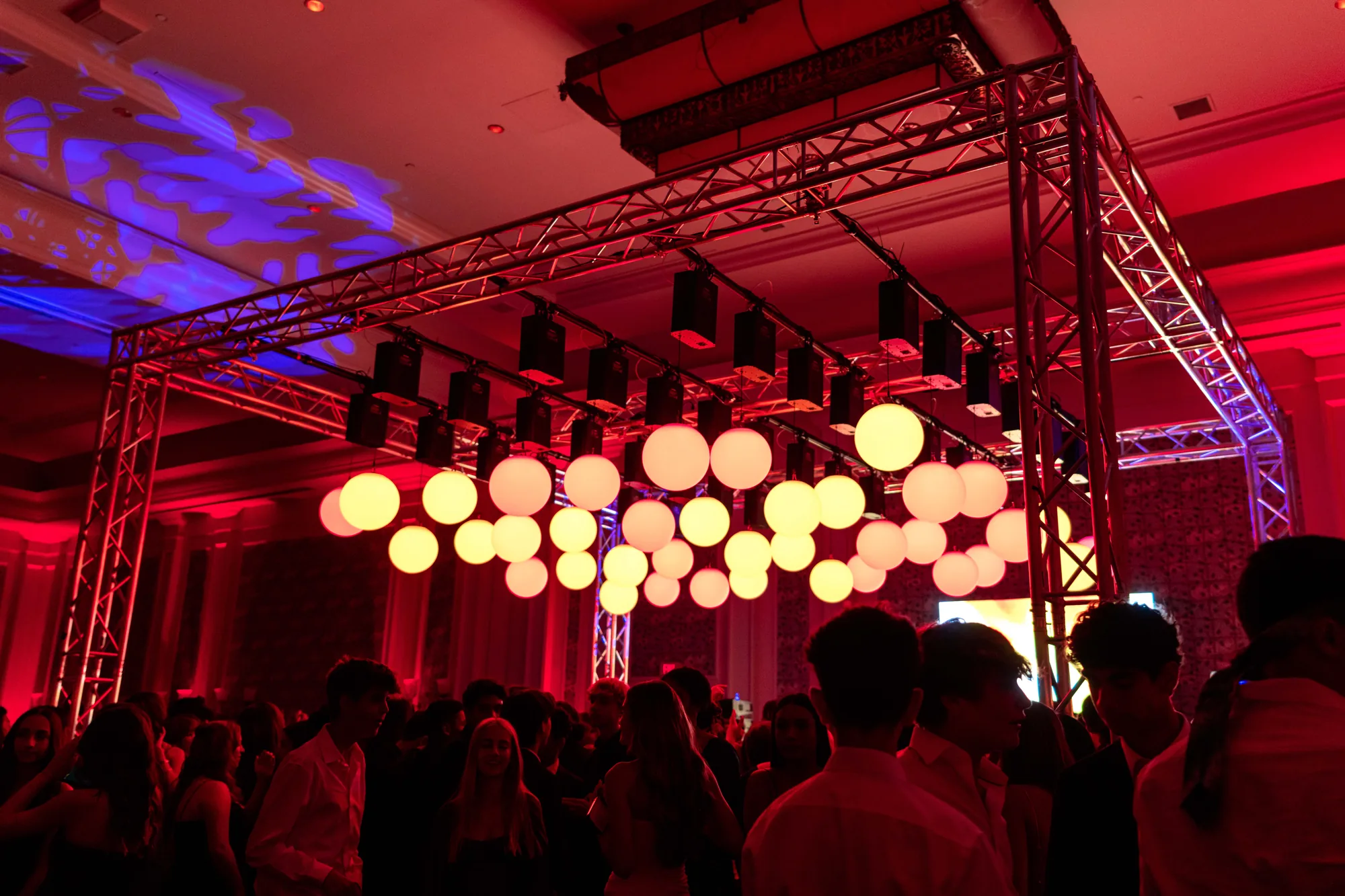 Kinetic LED spheres suspended over a packed dance floor at an Orlando corporate event