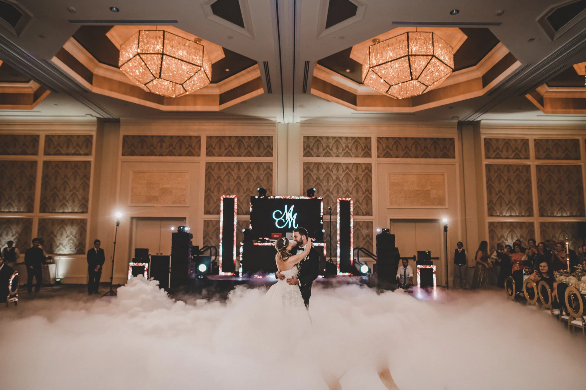 Couple dancing on a cloud effect during their first dance at an Orlando ballroom